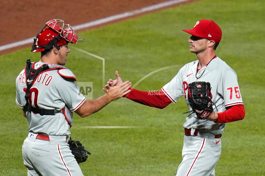 Gene J. Puskar Philadelphia Phillies relief pitcher Connor Brogdon (75) celebrates with catcher J.T. Realmuto after the team's 10-inning win over the Pittsburgh Pirates in a baseball game in Pittsburgh, Friday, July 29, 2022. (AP Photo/Gene J. Puskar)