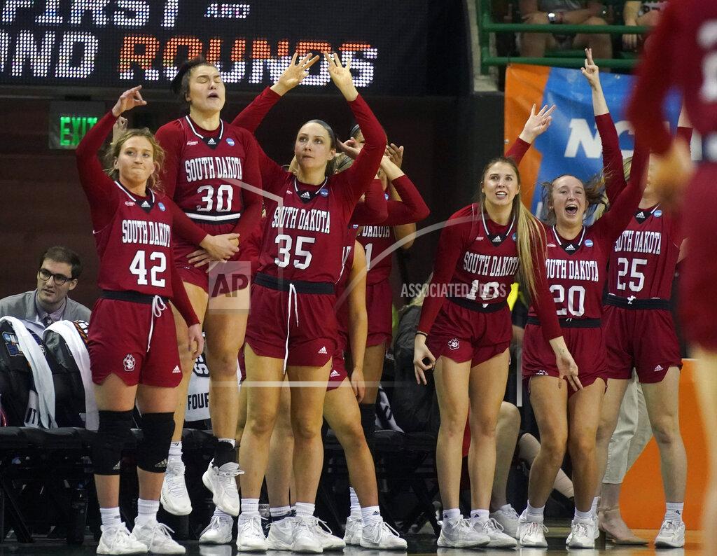 Lm Otero The South Dakota bench cheers during the second half of a college basketball game against Baylor in the second round of the NCAA tournament in Waco, Texas, Sunday, March 20, 2022. . (AP Photo/LM Otero)