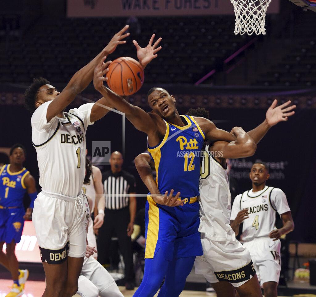 Walt Unks Pittsburgh's Abdoul Karim Coulibaly vies with Wake Forest's Isaiah Mucius (1) and Emmanuel Okpomo for a rebound during an NCAA college basketball game Saturday, Jan. 23, 2021, in Winston-Salem, N.C. (Walt Unks/The Winston-Salem Journal via AP)