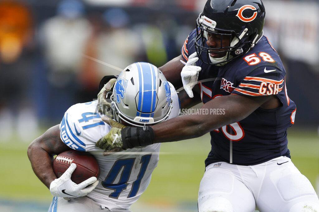 Charlie Neibergall Chicago Bears inside linebacker Roquan Smith (58) grabs the face mask of Detroit Lions running back J.D. McKissic (41) during the first half of an NFL football game in Chicago, Sunday, Nov. 10, 2019. (AP Photo/Charlie Neibergall)