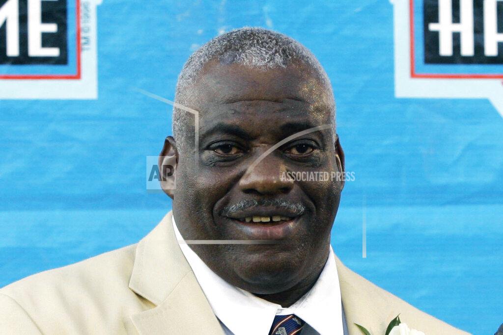 FILE - In this Saturday, Aug. 2, 2008, file photo, former San Diego Chargers smiles during ceremonies at the Pro Football Hall of Fame in Canton, Ohio. Dean, the fearsome pass rusher who was a key part of the launch of the San Francisco 49ers' dynasty, has died. He was 68. His death on Wednesday night, Oct. 14, 2020, was confirmed Thursday by the Pro Football Hall of Fame in Canton, Ohio. (AP Photo/Kiichiro Sato, File)