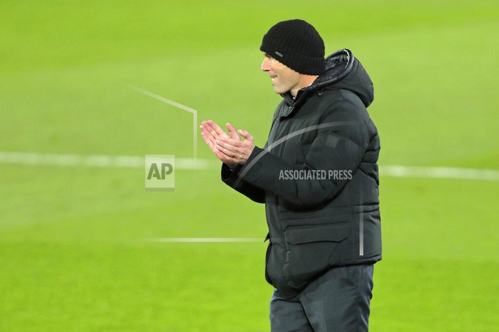 Manu Fernandez Real Madrid's head coach Zinedine Zidane gestures as he follows the action during the Spanish La Liga soccer match between Real Madrid and Celta Vigo at the Alfredo Di Stefano stadium in Madrid, Spain, Saturday, Jan. 2, 2021. (AP Photo/Manu Fernandez)
