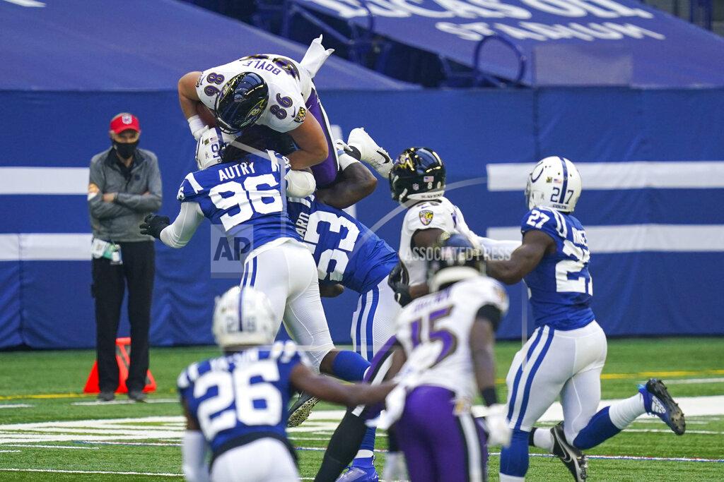 Darron Cummings Baltimore Ravens tight end Nick Boyle (86) is tackled by Indianapolis Colts defensive tackle Denico Autry (96) and outside linebacker Darius Leonard (53) in the first half of an NFL football game in Indianapolis, Sunday, Nov. 8, 2020. (AP Photo/Darron Cummings)