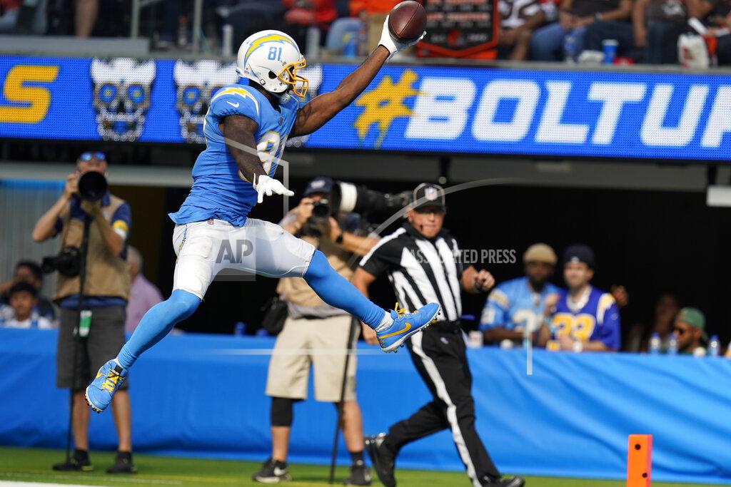 Gregory Bull Los Angeles Chargers wide receiver Mike Williams leaps into the end zone to score a touchdown during the second half of an NFL football game against the Cleveland Browns Sunday, Oct. 10, 2021, in Inglewood, Calif. (AP Photo/Gregory Bull)