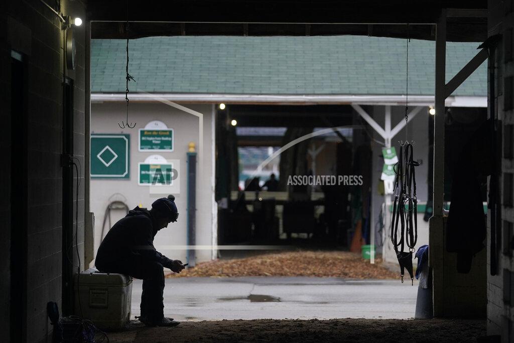 Darron Cummings An exercise rider reads his messages after taking a horse for a workout at Churchill Downs, Wednesday, Sept. 2, 2020, in Louisville, Ky. (AP Photo/Darron Cummings)