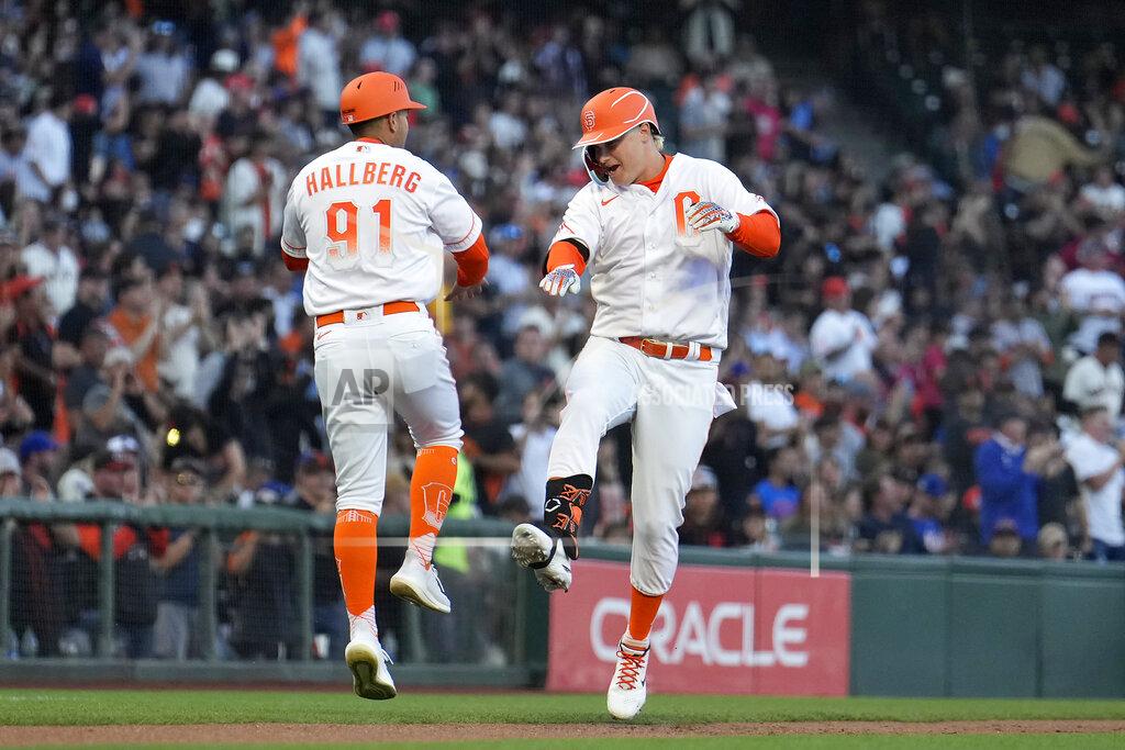 Tony Avelar San Francisco Giants' Joc Pederson, right, celebrates with third base coach Mark Hallberg (91) after hitting a two-run home run against the New York Mets during the third inning of a baseball game in San Francisco, Tuesday, May 24, 2022. (AP Photo/Tony Avelar)