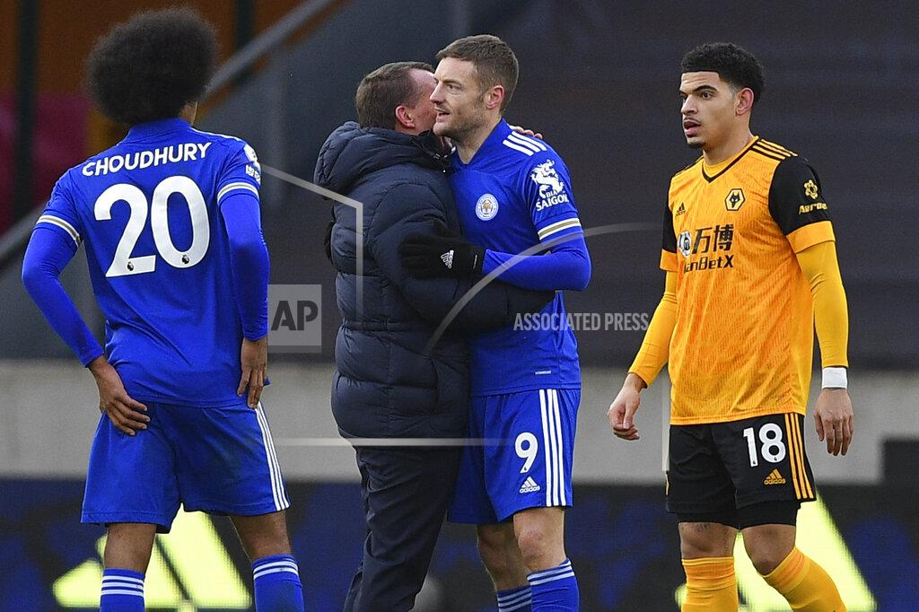 Justin Tallis Leicester's manager Brendan Rodgers embraces Leicester's Jamie Vardy at the end of the English Premier League match between Wolves and Leicester City at the Molineux Stadium in Wolverhampton, England Sunday, Feb. 7, 2021. (Justin Tallis/Pool via AP)
