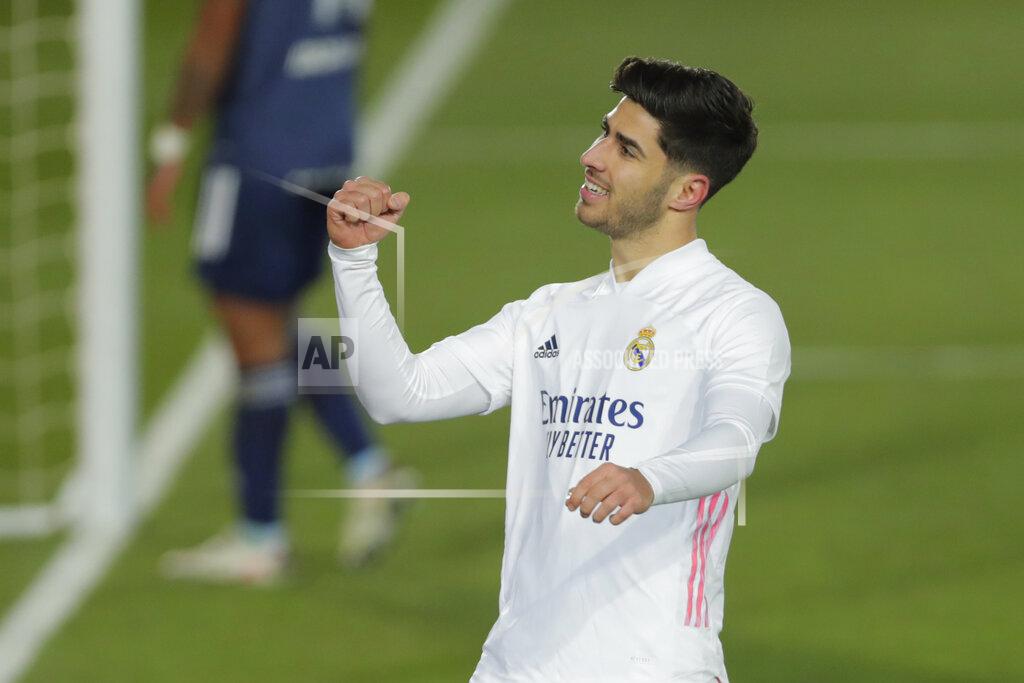 Manu Fernandez Real Madrid's Marco Asensio celebrates after scoring his side's second goal during the Spanish La Liga soccer match between Real Madrid and Celta Vigo at the Alfredo Di Stefano stadium in Madrid, Spain, Saturday, Jan. 2, 2021. (AP Photo/Manu Fernandez)