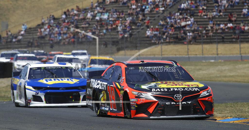 Ben Margot Martin Truex Jr., right, leads through a turn during a NASCAR Sprint Cup Series auto race Sunday, June 23, 2019, in Sonoma, Calif. (AP Photo/Ben Margot)
