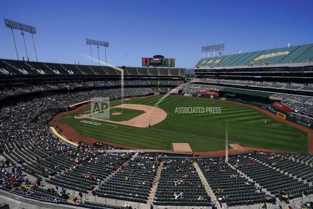 Jeff Chiu Fans watch as Oakland Athletics' James Kaprielian pitches against the Los Angeles Angels during the sixth inning of a baseball game in Oakland, Calif., Tuesday, July 20, 2021. (AP Photo/Jeff Chiu)