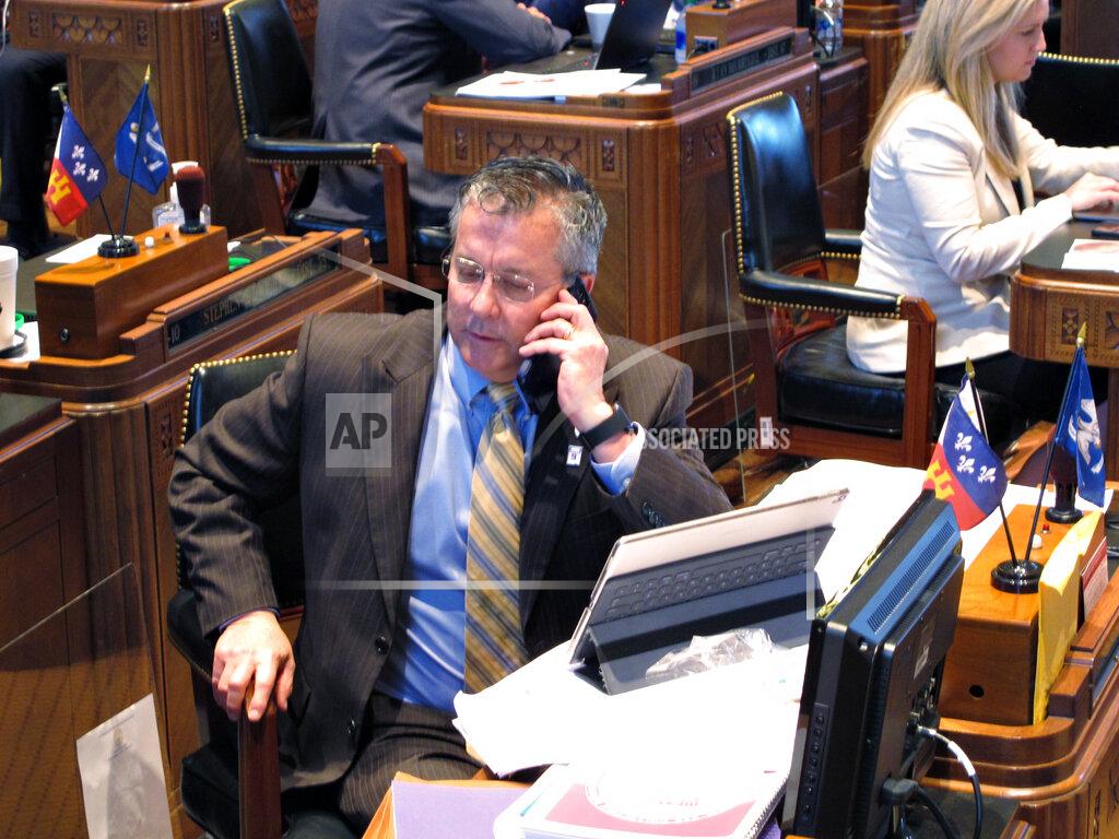 Melinda Deslatte House Appropriations Chairman Jerome "Zee" Zeringue, R-Houma, talks on the phone on the House floor as the Louisiana Legislature reached the final hours of its legislative session, on Monday, June 29, 2020, in Baton Rouge, La. (AP Photo/Melinda Deslatte)