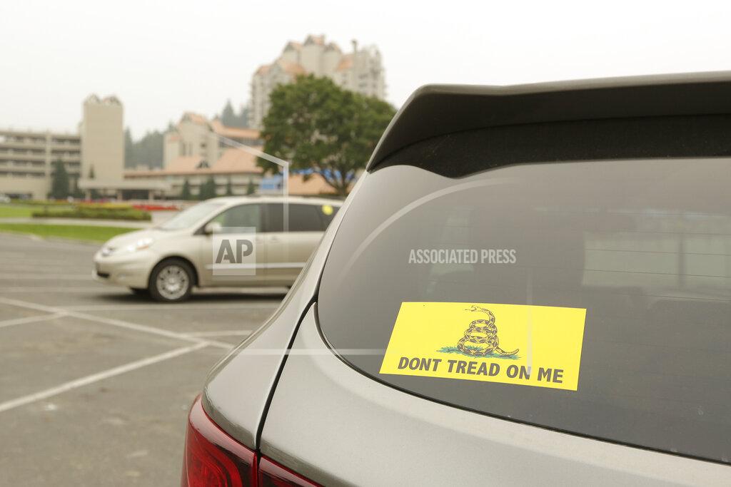 Young Kwak A vehicle with a Gadsden flag sticker is parked in the lot at Independence Point, Friday, Sept. 10, 2021, in Coeur d'Alene, Idaho. Northern Idaho has a long and deep streak of antigovernment activism that is confounding attempts to battle a COVID-19 outbreak.(AP Photo/Young Kwak)