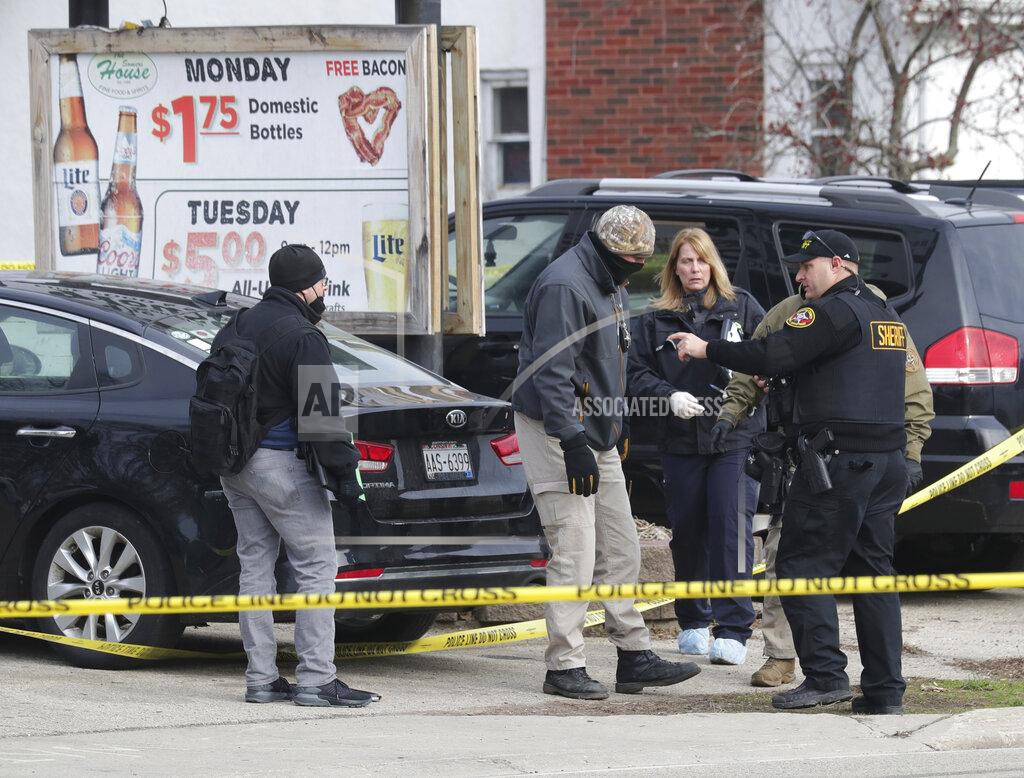 Mike De Sisti Officials investigate the scene of a deadly shooting at Somers House Tavern in Kenosha, Wis., Sunday, April 18, 2021. Several people were killed and two were seriously wounded in a shooting at the busy tavern in southeastern Wisconsin early Sunday, sheriff's officials said. (Mike De Sisti/Milwaukee Journal-Sentinel via AP)