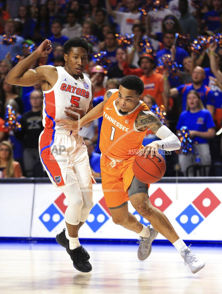 Matt Stamey Tennessee guard Lamonte Turner (1) drives past Florida guard KeVaughn Allen (5) during the first half of an NCAA college basketball game Saturday, Jan. 12, 2019, in Gainesville, Fla. (AP Photo/Matt Stamey)