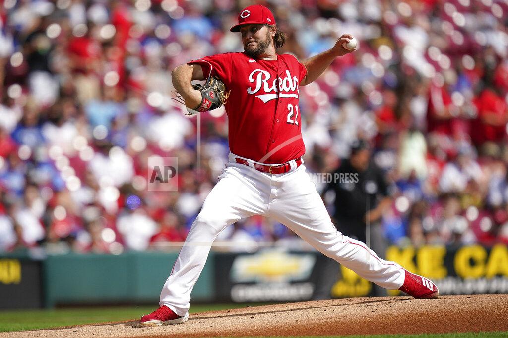 Bryan Woolston Cincinnati Reds starting pitcher Wade Miley (22) delivers during the first inning of a baseball game against the Los Angeles Dodgers in Cincinnati, Sunday, Sept 19, 2021. (AP Photo/Bryan Woolston)