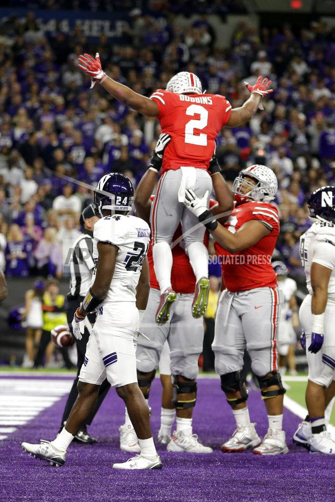 Aj Mast Ohio State's J.K. Dobbins (2) celebrates a touchdown run as Northwestern cornerback Montre Hartage (24) watches during the first half of the Big Ten championship NCAA college football game, Saturday, Dec. 1, 2018, in Indianapolis. (AP Photo/AJ Mast)