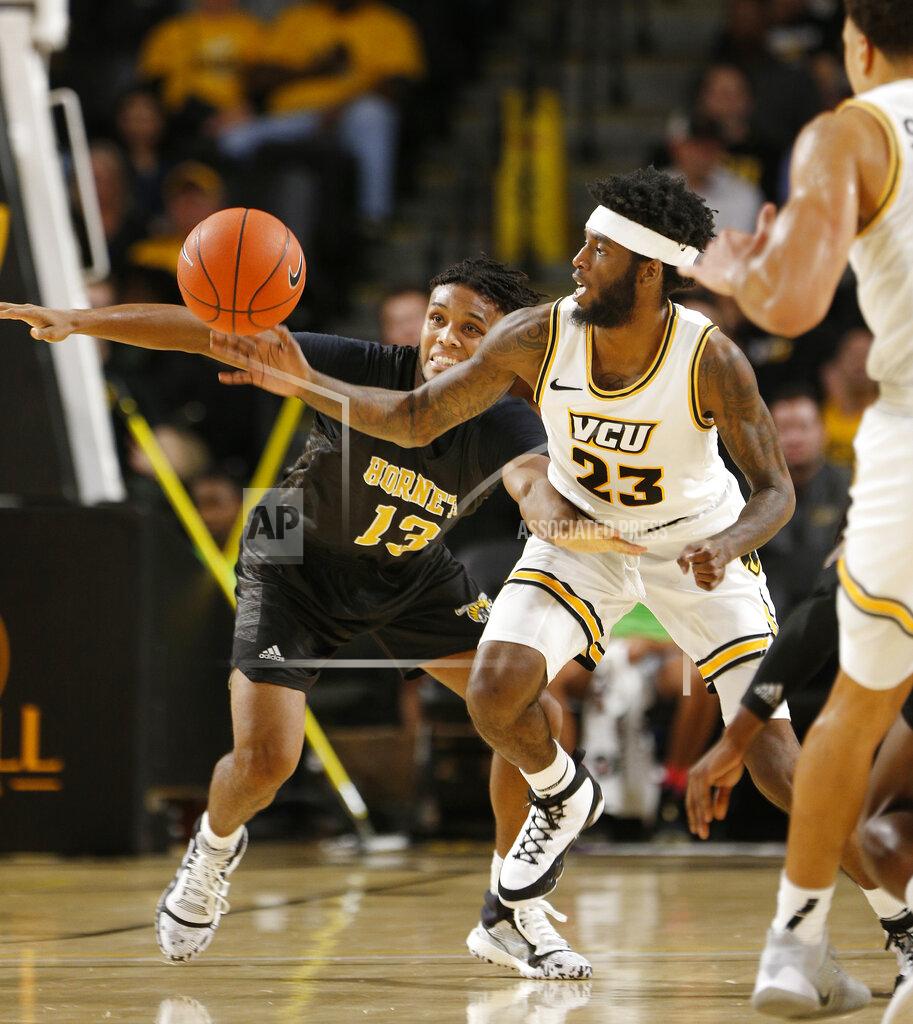 James H. Wallace Virginia Commonwealth's Issac Vann (23) goes after a steal after the ball was knocked away from Alabama State's AJ Farrar (13) during an NCAA college basketball game in Richmond, Va., Monday, Nov. 25, 2019. (James H. Wallace/Richmond Times-Dispatch via AP)