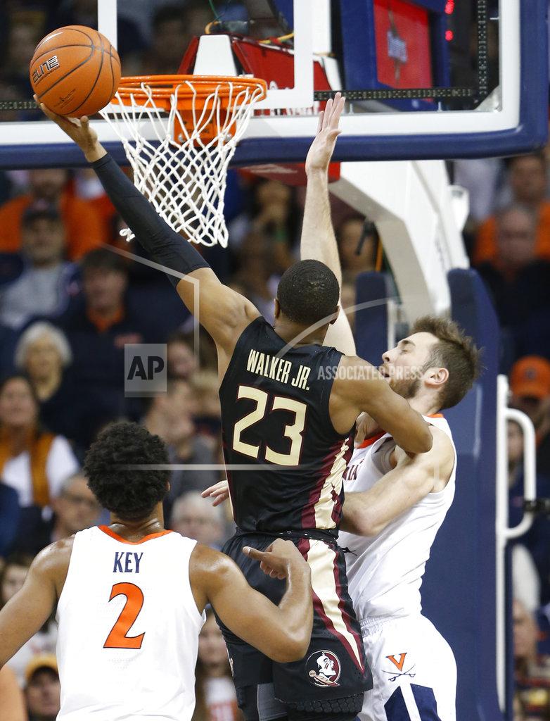 Steve Helber Florida State guard M.J. Walker (23) takes a shot over Virginia forward Jay Huff (30) during the first half of an NCAA college basketball game in Charlottesville, Va., Saturday, Jan. 5, 2019. (AP Photo/Steve Helber)