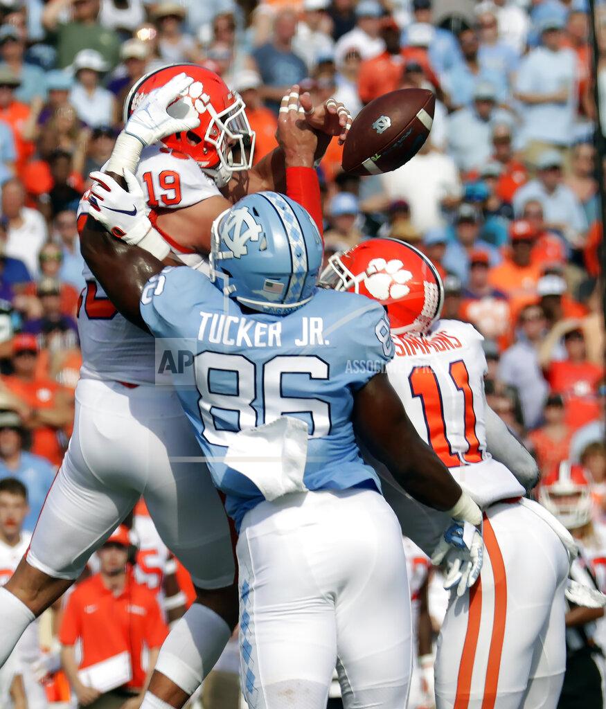 Chris Seward Clemson's Tanner Muse (19) and Isaiah Simmons (11) break up a pass intended for North Carolina's Carl Tucker (86) during the first quarter of an NCAA college football game against North Carolina in Chapel Hill, N.C., Saturday, Sept. 28, 2019. (AP Photo/Chris Seward)
