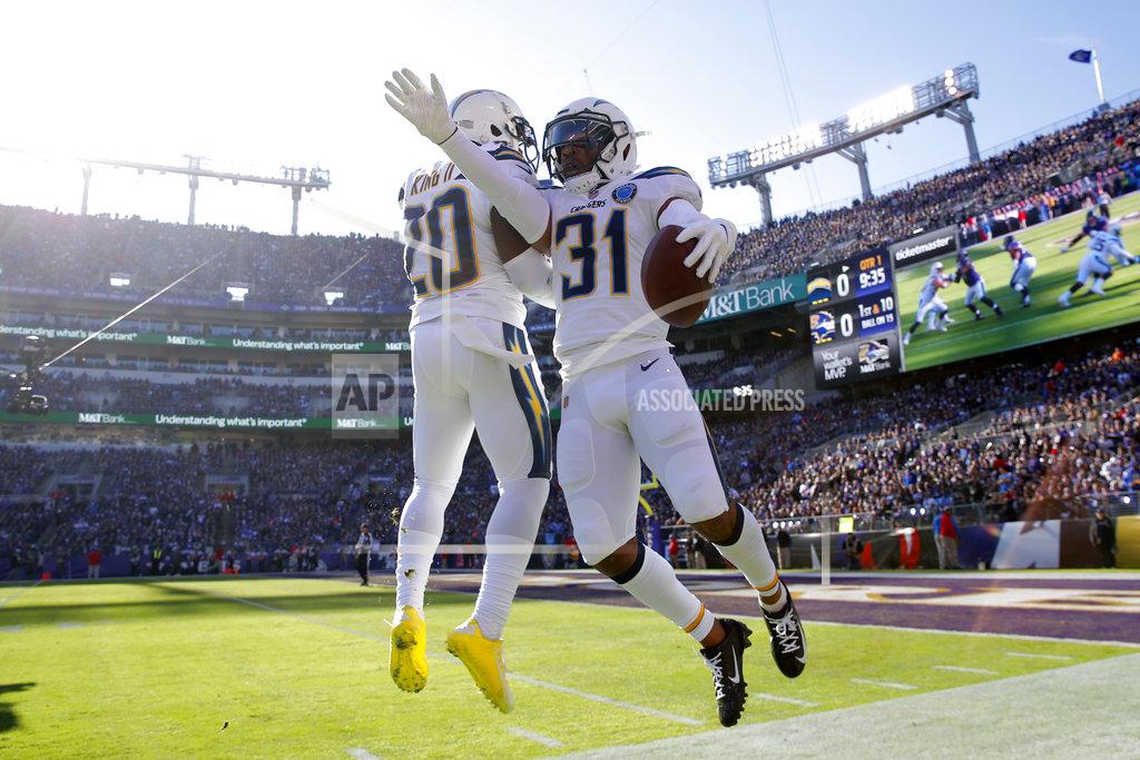 Carolyn Kaster Los Angeles Chargers defensive back Adrian Phillips, right, celebrates with teammate Desmond King after recovering a fumble in the first half of an NFL wild card playoff football game against the Baltimore Ravens, Sunday, Jan. 6, 2019, in Baltimore. (AP Photo/Carolyn Kaster)