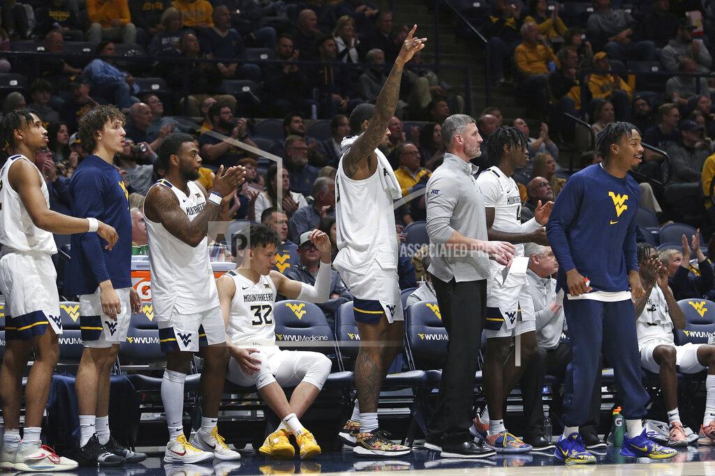 Kathleen Batten West Virginia players react during the first half of an NCAA college basketball game against Morehead State in Morgantown, W.Va., Tuesday, Nov. 15, 2022. (AP Photo/Kathleen Batten)