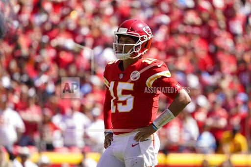 Kansas City Chiefs quarterback Patrick Mahomes (15) watches during the first half of an NFL football game against the Los Angeles Chargers, Sunday, Sept. 26, 2021, in Kansas City, Mo. (AP Photo/Ed Zurga)