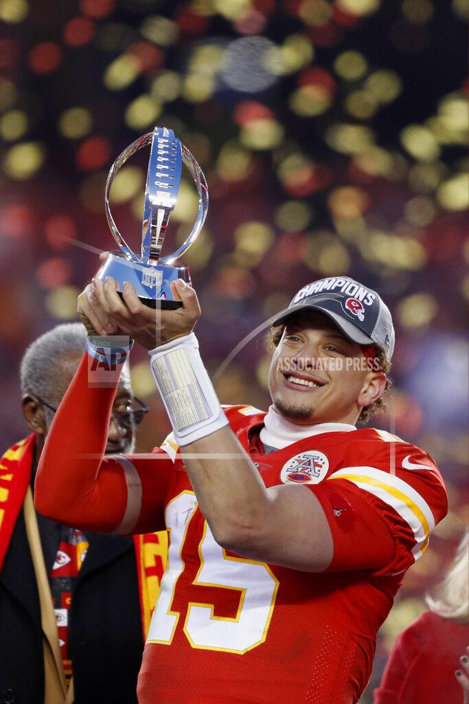 Charlie Neibergall Kansas City Chiefs' Patrick Mahomes holds up the Lamar Hunt Trophy after the NFL AFC Championship football game against the Tennessee Titans Sunday, Jan. 19, 2020, in Kansas City, MO. The Chiefs won 35-24 to advance to Super Bowl 54. (AP Photo/Charlie Neibergall)