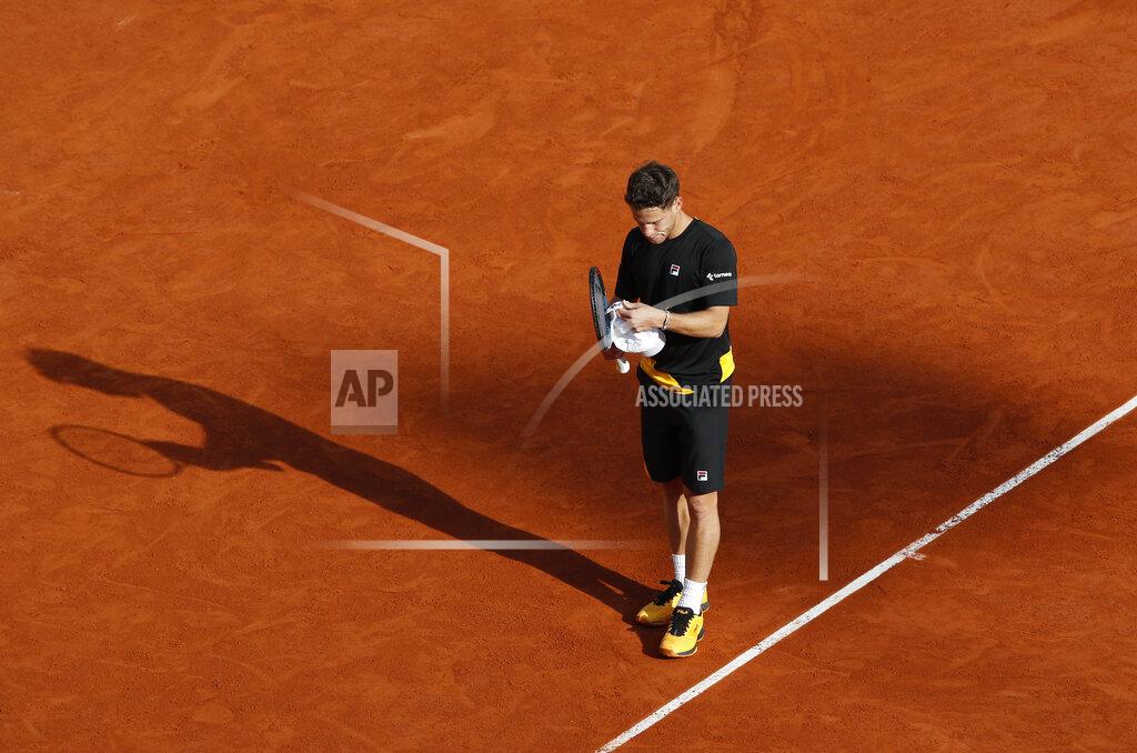 Alessandra Tarantino Argentina's Diego Schwartzman adjusts his cap in his match against Spain's Rafael Nadal in the semifinal of the French Open tennis tournament at the Roland Garros stadium in Paris, France, Friday, Oct. 9, 2020. (AP Photo/Alessandra Tarantino)