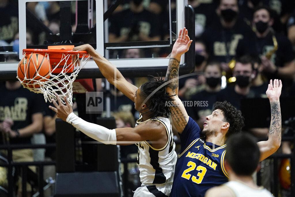 Darron Cummings Purdue guard Jaden Ivey (23) dunks against Michigan forward Brandon Johns Jr. (23) during the first half of an NCAA college basketball game, Saturday, Feb. 5, 2022, in West Lafayette, Ind. (AP Photo/Darron Cummings)