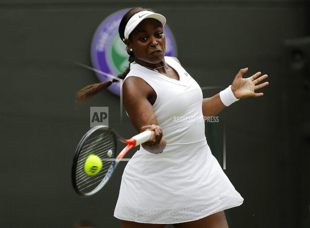Ben Curtis FILE - In this July 6, 2019, file photo, Sloane Stephens returns to Britain's Johanna Konta in a women's singles match at the Wimbledon Tennis Championships in London. Any World TeamTennis player or coach who tests positive for COVID-19 when arriving for the three-week 2020 season will be dropped from the league without pay. The health plan released Tuesday, June 16, 2020, by the WTT for its matches starting July 12 at The Greenbrier in West Virginia also calls for two daily temperature checks for spectators, no ball kids, a chair umpire aided by electronic line-calling instead of line judges, and no high-fives or handshakes between opponents. The rosters announced for the WTT's nine teams include Grand Slam title winners Kim Clijsters, Sloane Stephens, Sofia Kenin and the Bryan brothers. (AP Photo/Ben Curtis, File)
