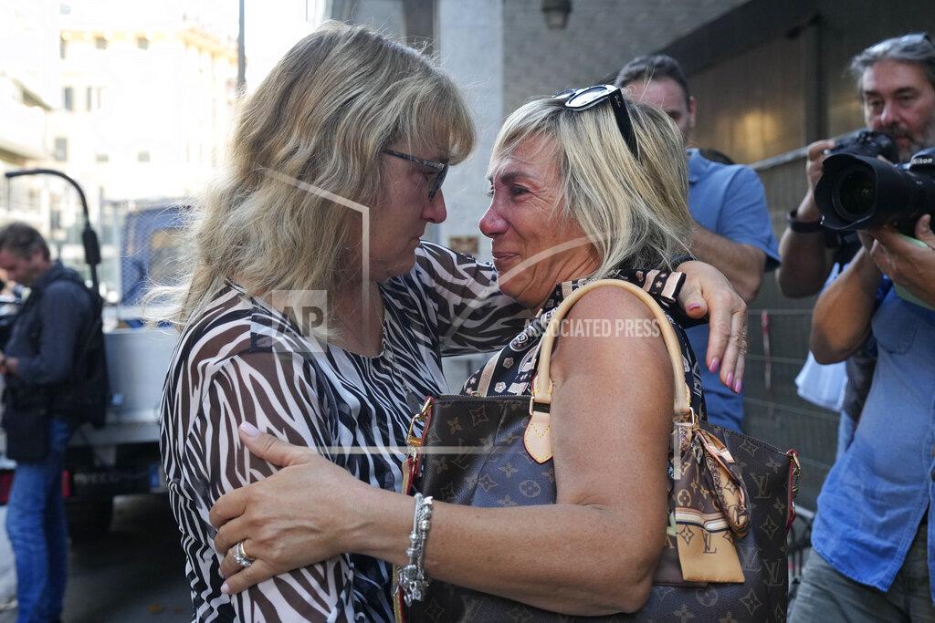 Antonio Calanni Paola Vicini, right, and Maria Grazia Lonigro, mothers of Mirko Vicini and Luigi Matti Altadonna, two of the 43 victims, greet each other outside the Genoa's Palace of Justice on opening of the first hearing of the trial for the Morandi bridge collapse,Thursday, July 7, 2022. Forty-three people were killed when a large stretch of the Morandi Bridge broke off, August 14, 2018, on the eve of one of Italy's biggest vacation holidays. (AP Photo/Antonio Calanni)