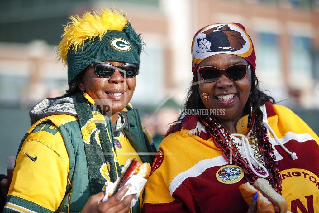 Matt Ludtke Sheena Driscoll and Talissa McMullen tailgate before before an NFL football game between the Green Bay Packers and the Washington Football Team Sunday, Oct. 24, 2021, in Green Bay, Wis. (AP Photo/Matt Ludtke)