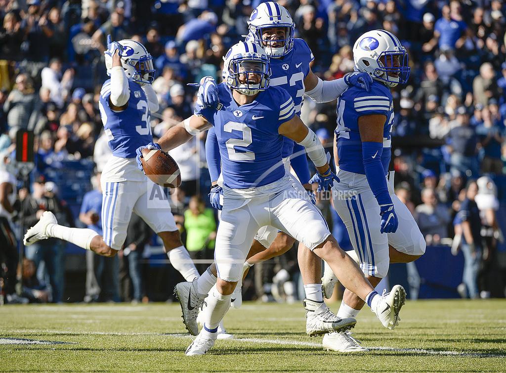 BYU defensive back Austin Lee (2) celebrates his 26-yard interception for a touchdown against Idaho State during an NCAA college football game, Saturday, Nov. 16, 2019, at LaVell Edwards Stadium, in Provo, Utah. (Leah Hogsten/The Salt Lake Tribune via AP)