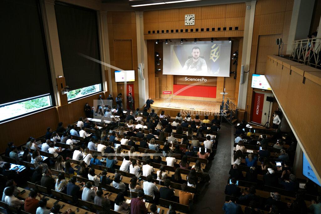Thibault Camus Ukrainian President Volodymyr Zelensky speaks to students of the Institute of Political Studies (IEP) or Sciences Po university, in Paris, Wednesday, May 11, 2022. (AP Photo/Thibault Camus)