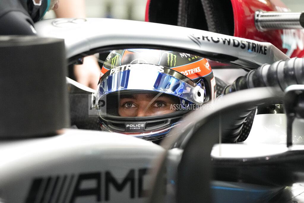 Hassan Ammar Mercedes driver George Russell of Britain sits in his car during a practice for theFormula One Bahrain Grand Prix it in Sakhir, Bahrain, Friday, March 18, 2022. (AP Photo/Hassan Ammar)
