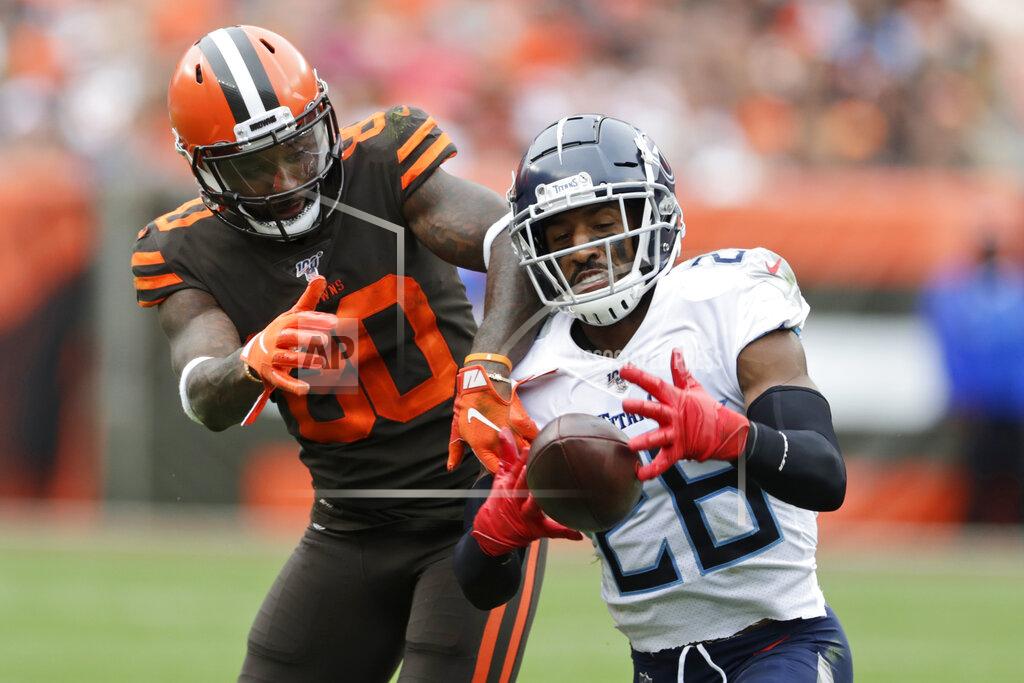 Ron Schwane Tennessee Titans cornerback Logan Ryan (26) intercepts a throw intended for Cleveland Browns wide receiver Jarvis Landry (80) during the second half of an NFL football game Sunday, Sept. 8, 2019, in Cleveland. (AP Photo/Ron Schwane)