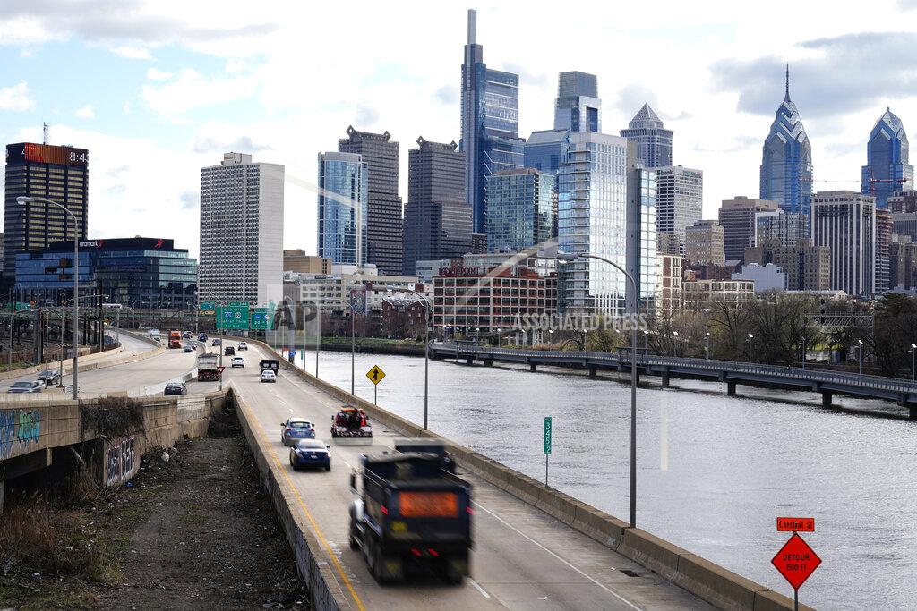 Morning traffic moves along Interstate 76 in Philadelphia, Monday, March 29, 2021. U.S. drivers recently reached a major milestone when the number of daily passenger vehicle trips reached pre-pandemic levels for the first time in a year, according to data provided to The Associated Press by the transportation analytics firm Inrix. It's a potential indicator that the pandemic's strain on society may be easing. (AP Photo/Matt Rourke)