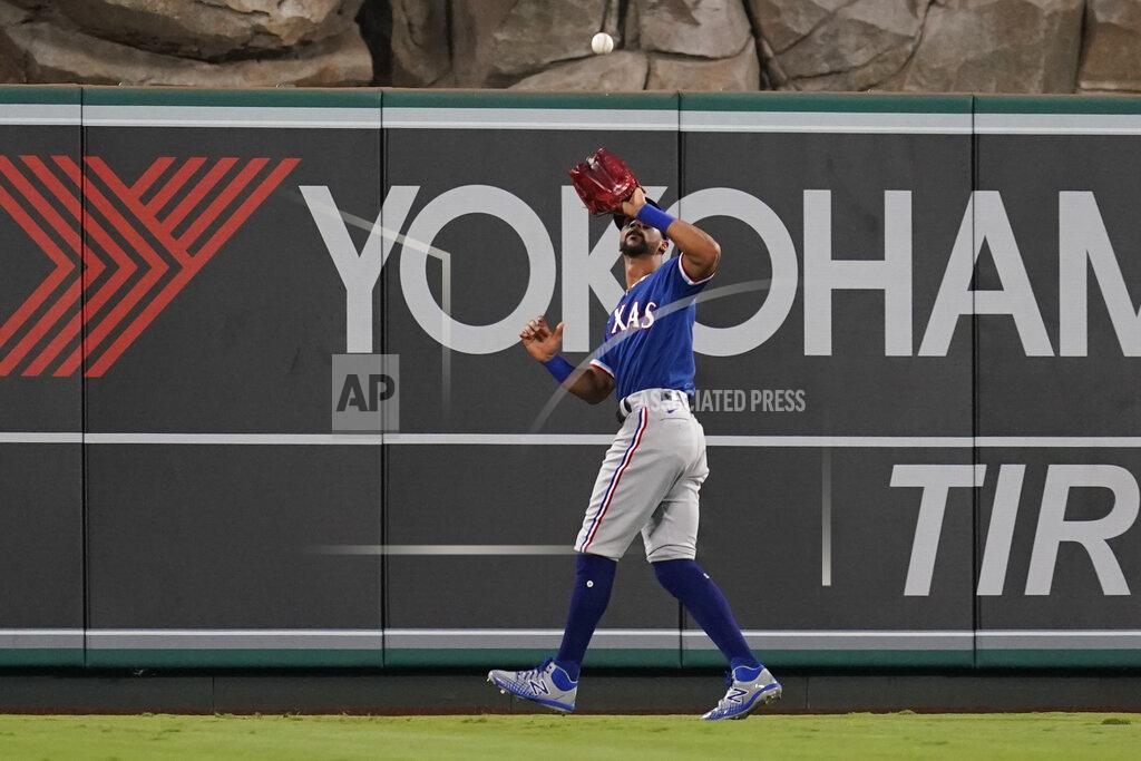 Ashley Landis Texas Rangers center fielder Leody Taveras (3) catches a fly ball hit by Los Angeles Angels' Jack Mayfield during the sixth inning of a baseball game Friday, Sep. 3, 2021, in Anaheim, Calif. (AP Photo/Ashley Landis)
