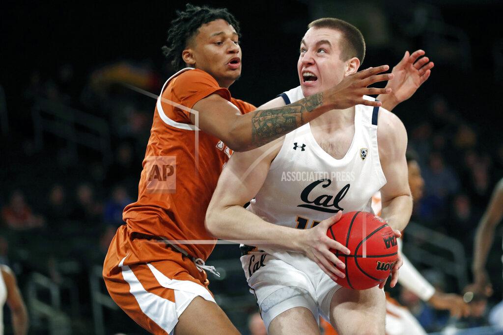 Kathy Willens Texas forward Jericho Sims (20) defends California forward Grant Anticevich (15) during the first half of an NCAA college basketball game in the 2K Empire Classic, Friday, Nov. 22, 2019, in New York. (AP Photo/Kathy Willens)