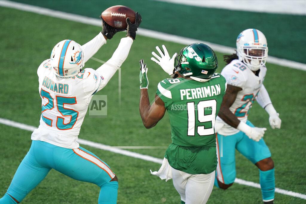 Corey Sipkin Miami Dolphins' Xavien Howard (25), left, breaks up a pass intended for New York Jets' Breshad Perriman (19) during the first half of an NFL football game, Sunday, Nov. 29, 2020, in East Rutherford, N.J. (AP Photo/Corey Sipkin)