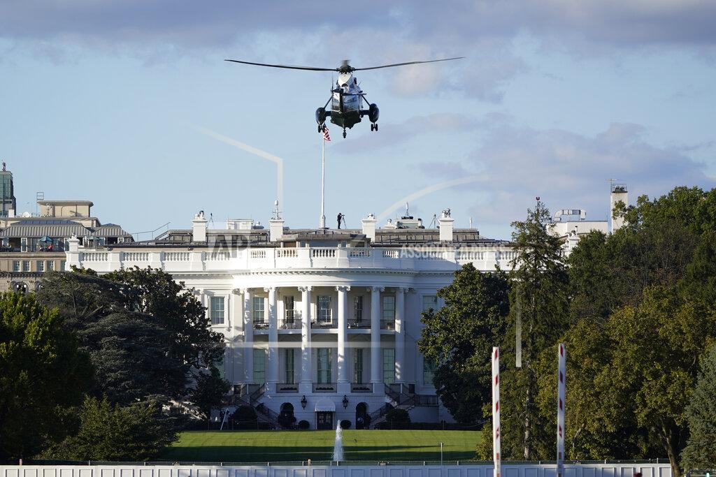J. Scott Applewhite The helicopter that will carry President Donald Trump to Walter Reed National Military Medical Center in Bethesda, Md., lands on the South Lawn of White House in Washington, Friday, Oct. 2, 2020. The White House says Trump will spend a "few days" at the military hospital after contracting COVID-19. (AP Photo/J. Scott Applewhite)