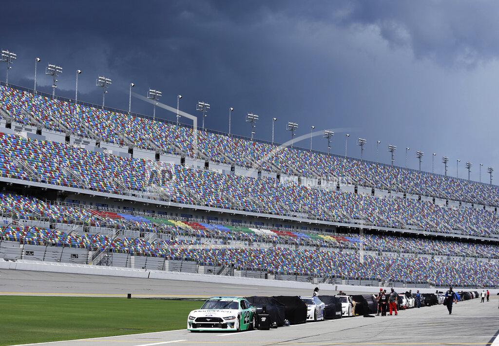 Terry Renna Race cars line pit road as Weather in the area delays the start of the NASCAR Xfinity series auto race at Daytona International Speedway, Saturday, Aug. 15, 2020, in Daytona Beach, Fla. (AP Photo/Terry Renna)