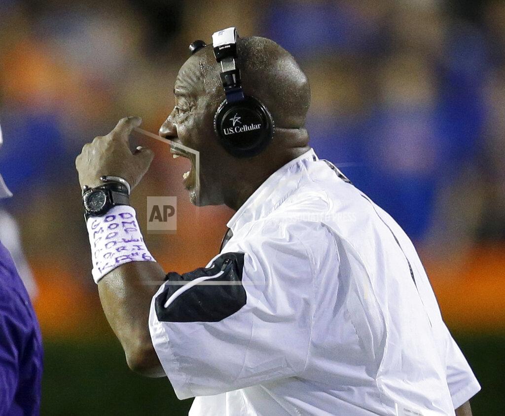 John Raoux FILE - East Carolina coach Ruffin McNeill motions to his players during the second half of the team's NCAA college football game against Florida, Sept. 12, 2015, in Gainesville, Fla. Schools throughout the Atlantic Coast Conference and college football have hired more staffers working in roles such as analyst, quality-control coordinator or special assistant to handle the ever-rising duties of running a power-conference program. McNeill is working as a special assistant to North Carolina State head coach Dave Doeren. (AP Photo/John Raoux, File)