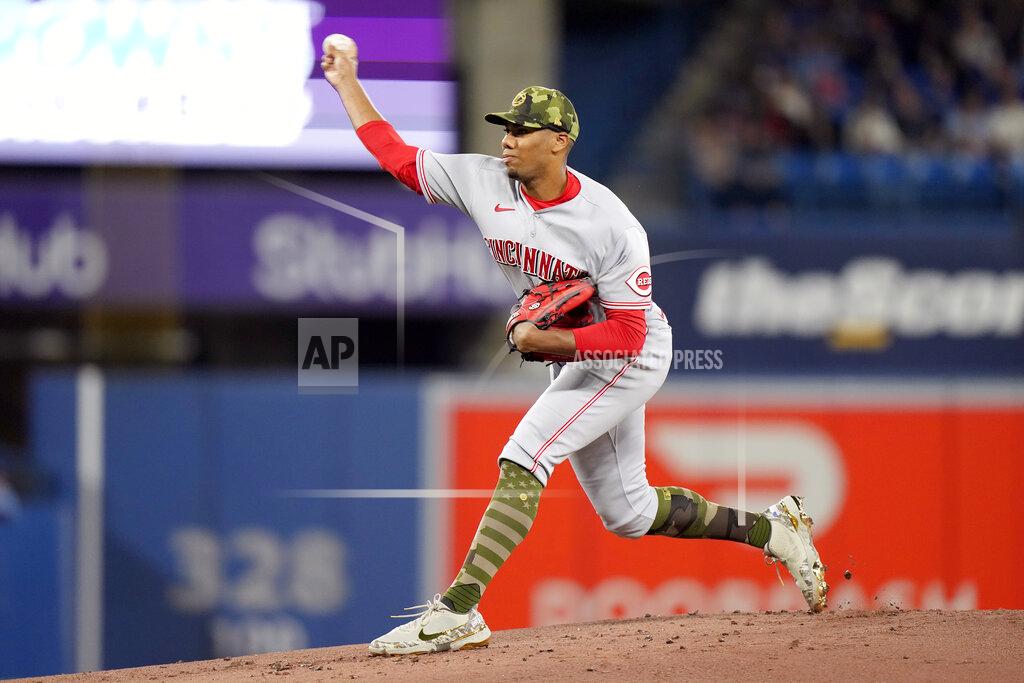 Frank Gunn Cincinnati Reds starting pitcher Hunter Greene (21) works against the Toronto Blue Jays during the first inning of a baseball game in Toronto, Saturday, May 21, 2022. (Frank Gunn/The Canadian Press via AP)