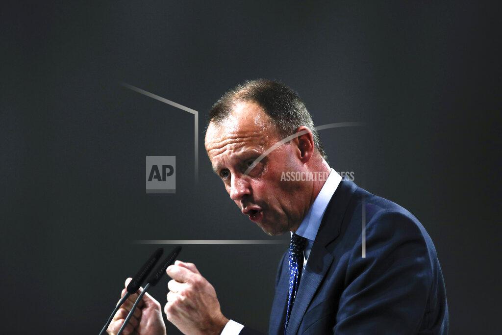 Markus Schreiber FILE - In this Friday, Dec. 7, 2018. File photo, Friedrich Merz party member and candidate for the Christian Democratic Union, CDU, party chairmanship delivers his speech during a party convention in Hamburg, Germany. German Chancellor Angela Merkel's center-right party, the Christian Democratic Union, CDU, is choosing a new leader on the weekend Saturday Jan. 16 and Sunday Jan. 17, 2021, a decision that will help determine who succeeds Merkel at the helm of the European Union's biggest economy after a 16-year reign. (AP Photo/Markus Schreiber, file)