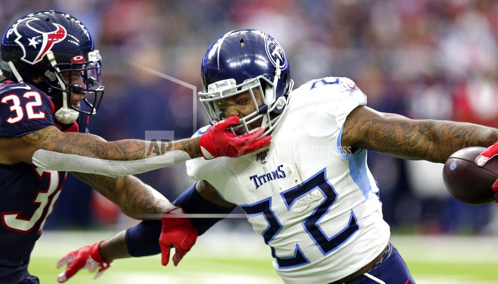Michael Wyke Houston Texans cornerback Lonnie Johnson (32) reaches to tackle Tennessee Titans running back Derrick Henry (22) during the first half of an NFL football game Sunday, Dec. 29, 2019, in Houston. (AP Photo/Michael Wyke)