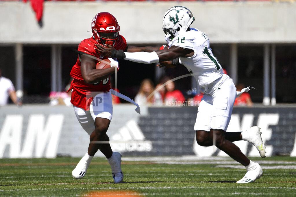 Timothy D. Easley Louisville wide receiver Chris Bell (80) is grabbed by South Florida cornerback Ben Knox (12) during the second half of an NCAA college football game in Louisville, Ky., Saturday, Sept. 24, 2022. Louisville won 41-3. (AP Photo/Timothy D. Easley)