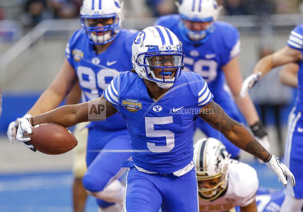 Steve Conner BYU defensive back Dayan Ghanwoloku (5) celebrates a 1-yard touchdown run against Western Michigan in the second half of the Famous Idaho Potato Bowl NCAA college football game, Friday, Dec. 21, 2018, in Boise, Idaho. (AP Photo/Steve Conner)
