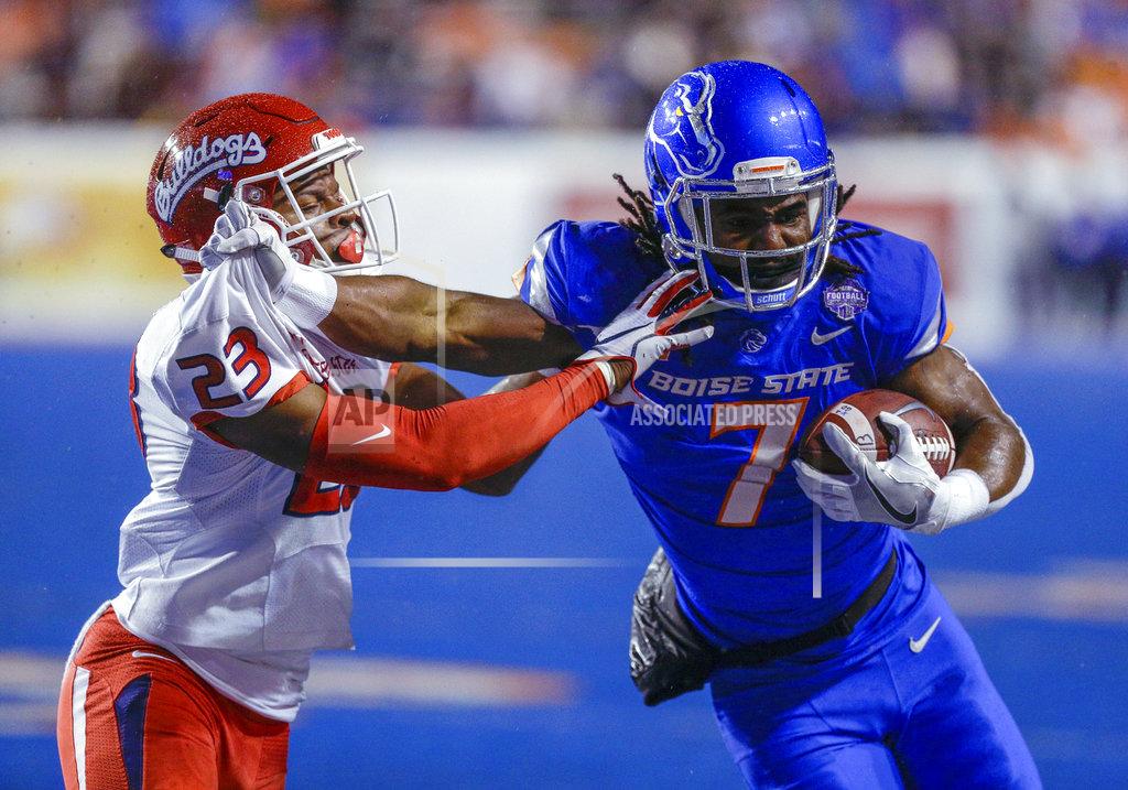 Steve Conner Boise State wide receiver A.J. Richardson (7) battles with Fresno State defensive back Juju Hughes (23) after a reception during the first half of an NCAA college football game for the Mountain West championship, Saturday, Dec. 1, 2018, in Boise, Idaho. (AP Photo/Steve Conner)