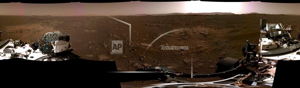 Uncredited This composite image made available by NASA, produced from photos captured Feb. 20, 2021 by the Perseverance Mars rover, shows the surface of Mars. It landed on Thursday, Feb. 18. (NASA/JPL-Caltech via AP)